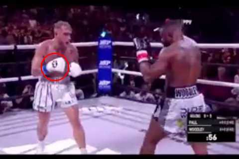 Jake Paul and Tyron Woodley accused of FIXING fight by fans after ‘secret hand signal’ spotted..