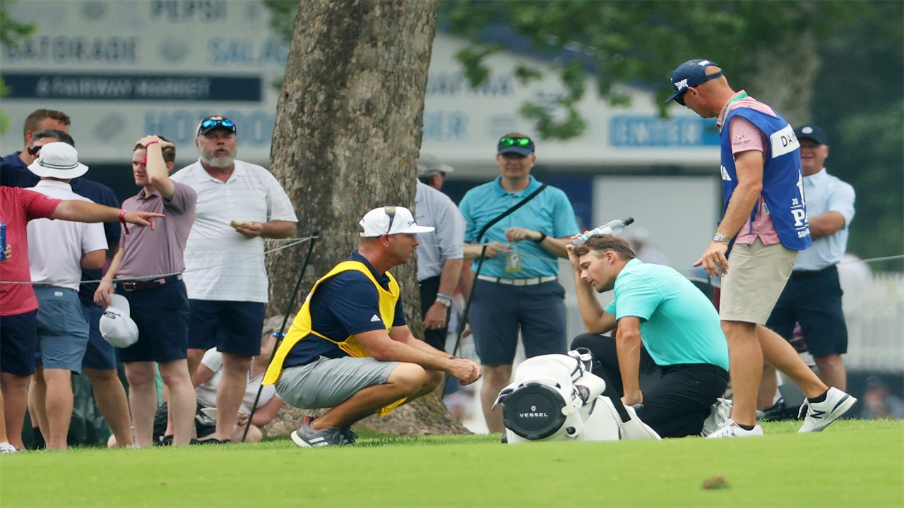 Aaron Wise luckily avoids injury after being hit on the HEAD from wayward Cameron Smith drive as he played seventh hole