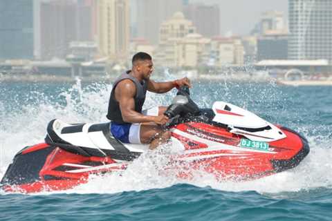 Anthony Joshua goes jet-skiing and shows off huge ripped body on holiday in Dubai ahead of..