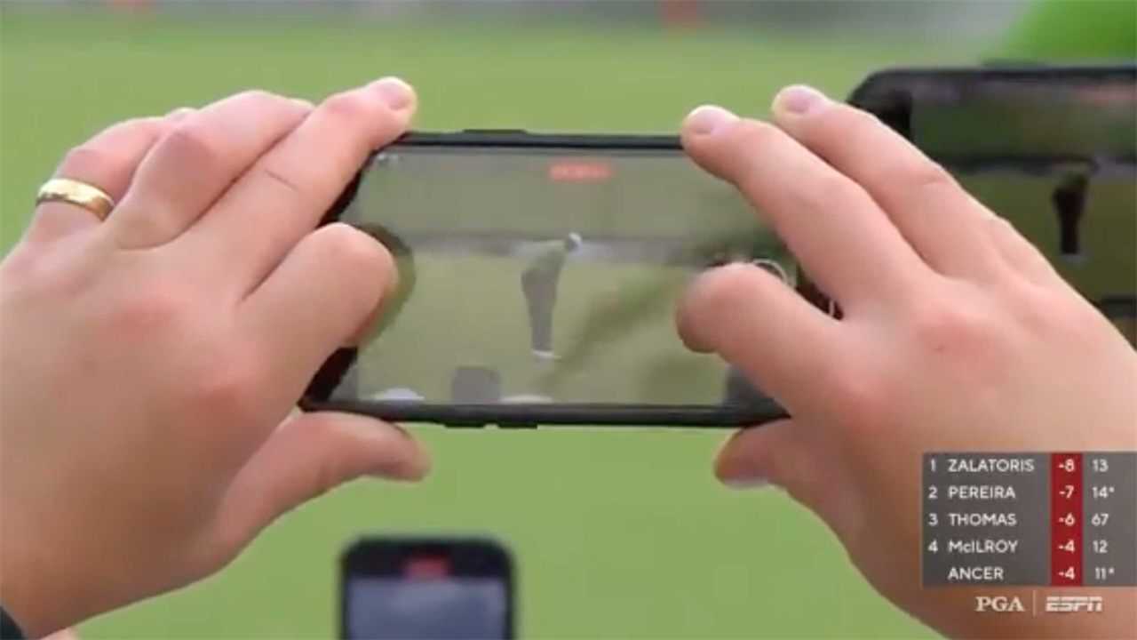 Artsy ESPN camera shot of Tiger Woods birdie putt agitates golf fans