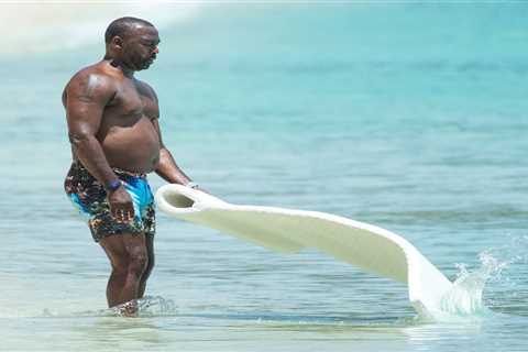 Man Utd legend Andy Cole takes dip in the sea as he relaxes on family holiday in Barbados