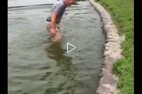 FUNNY GOLF SHOT WHERE MAN FALLS IN WATER