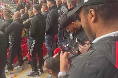 Bored Man Utd fan spotted getting a trim in Wembley stands during ‘dead game’