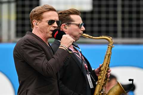 F1 fans absolutely baffled as Hollywood star sings national anthem ‘like Elvis’ alongside a..