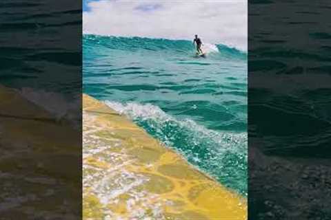 Surfer on a BEAUTIFUL clear wave in Hawai''i