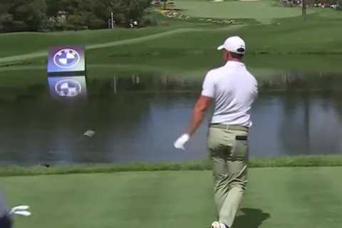 Watch awkward angry Rory McIlroy hurls his driver into a LAKE after bad tee-shot… and has to..